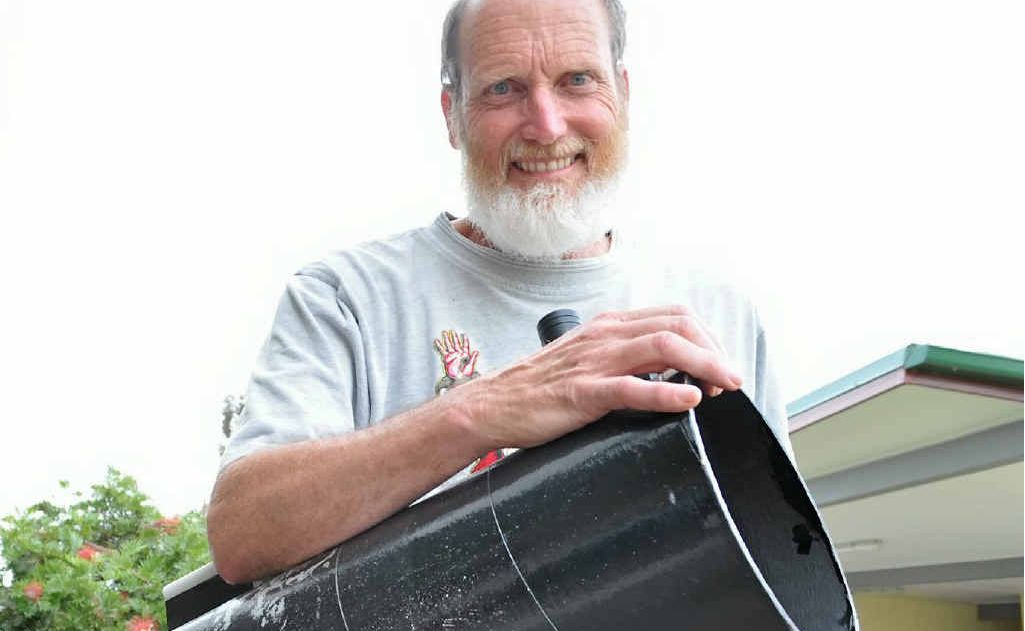 Star gazer and Warwick State High School science teacher Stuart Watt gets in practice for tonight’s lunar eclipse with the school’s telescope. Star gazer and Warwick State High School science teacher Stuart Watt gets in practice for tonight’s lunar eclipse with the school’s telescope.